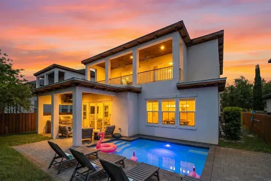 The kind of evening that makes you never want to leave — private heated pool, outdoor kitchen, second-floor deck, and a 30A sunset to top it all off