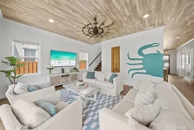 Coastal living at its best — sink into the sofas, turn on the 65" TV, and unwind after a perfect day on 30A.