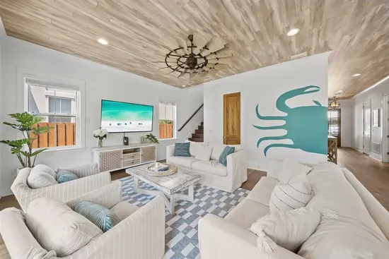 Coastal living at its best — sink into the sofas, turn on the 65" TV, and unwind after a perfect day on 30A.