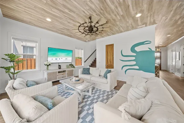 Coastal living at its best — sink into the sofas, turn on the 65" TV, and unwind after a perfect day on 30A.