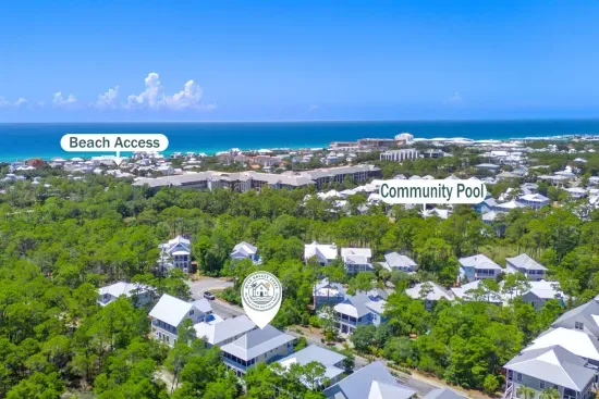 Your whole 30A world in one frame: the Blue Mountain Beach public access under half a mile out, the community pool just down the street, and the home tucked into the pines between them.