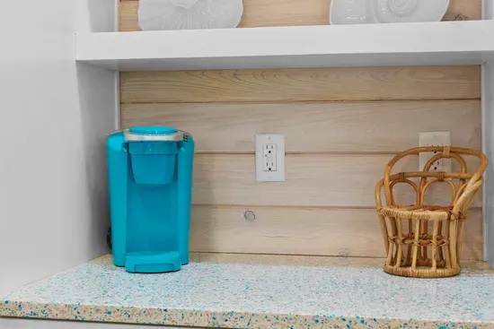 The Keurig is stocked with a starter supply of pods for your first morning.