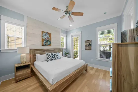 Pale blue walls, a ceiling fan, and dresser space that means you can actually unpack.