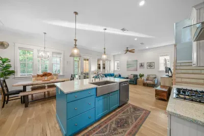 Kitchen, dining, and living all open to one another, so whoever is cooking is still part of the conversation.