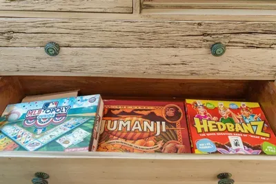 A drawer of board games for the evening everyone decides to stay in.