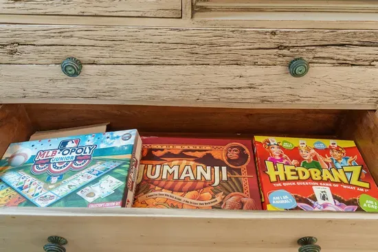 A drawer of board games for the evening everyone decides to stay in.