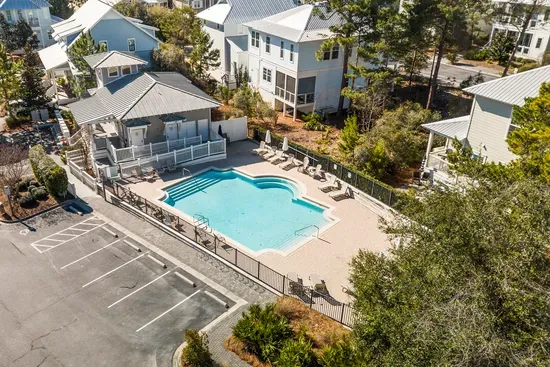 The community pool and clubhouse sit a short walk up the street, with parking right there.