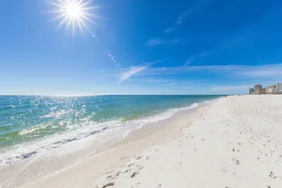 Your perfect Gulf Shores beach day starts here — soft white sand, endless views, and just a short walk from the house until your toes hit the sand