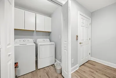 Washer and Dryer next to the elevator