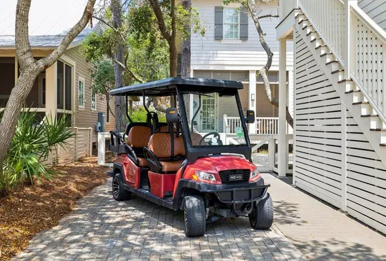 Yes, the golf cart’s included — a 6-seater, so the whole family rides together to the beach club, Camp WaterColor, or dinner in Seaside.