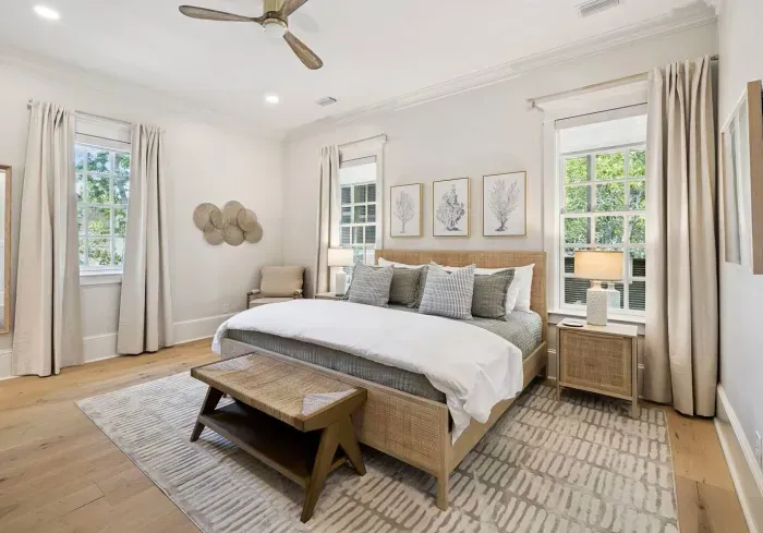 Wake up to sunlight on both sides of the bed. The serene primary suite pairs a king bed and luxe linens with calm, coastal style.