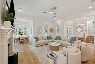 Sink in with a book or gather everyone for game night — this airy great room, wrapped in sunlight, is the heart of the home.