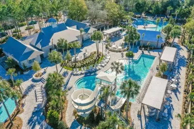 Say hello to Camp WaterColor — a pool playground with a waterslide the kids will ask for again and again.
