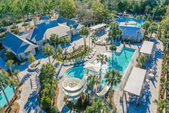 Say hello to Camp WaterColor — a pool playground with a waterslide the kids will ask for again and again.