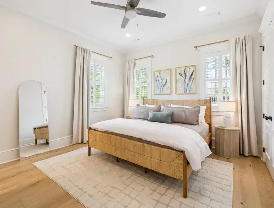 A room that feels like a getaway of its own — a woven banana stem king bed, hotel-quality Quince linens, and a Leesa mattress for deep, easy sleep.
