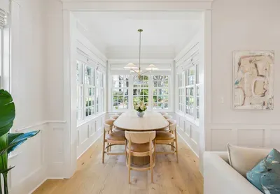 Everyone at one table — the dining area seats the group comfortably and sits just off both the living room and the kitchen.