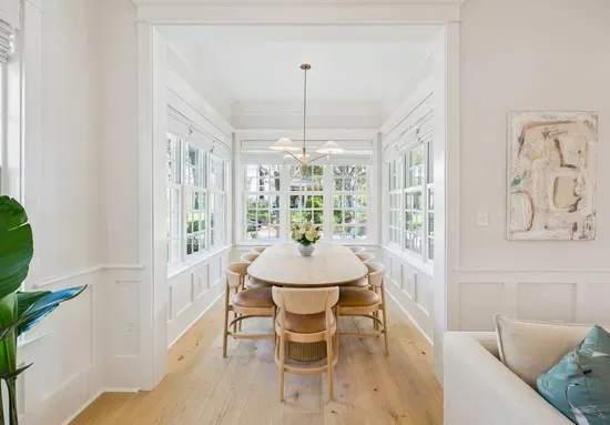 Everyone at one table — the dining area seats the group comfortably and sits just off both the living room and the kitchen.