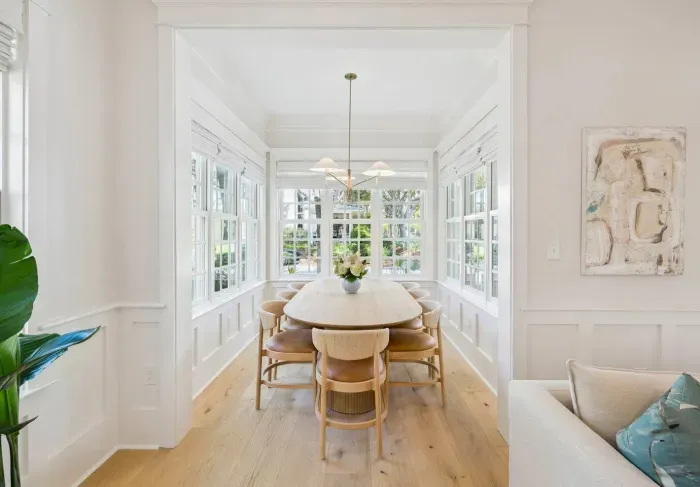 Everyone at one table — the dining area seats the group comfortably and sits just off both the living room and the kitchen.