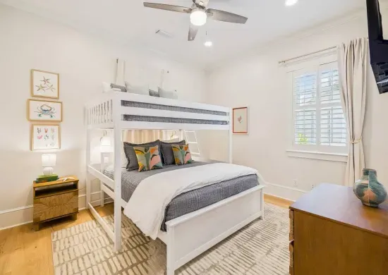 The kids’ favorite room — a twin-over-queen bunk with its own smart TV and playful coastal touches. Bonus: a grown-up fits comfortably on the queen below.