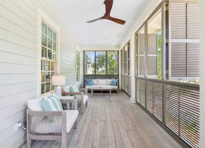 Tuck into a good book in the shade — this second-floor balcony is the home’s quiet corner, made for unwinding.