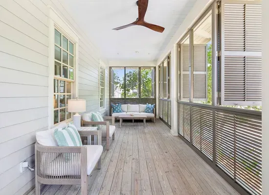 Tuck into a good book in the shade — this second-floor balcony is the home’s quiet corner, made for unwinding.