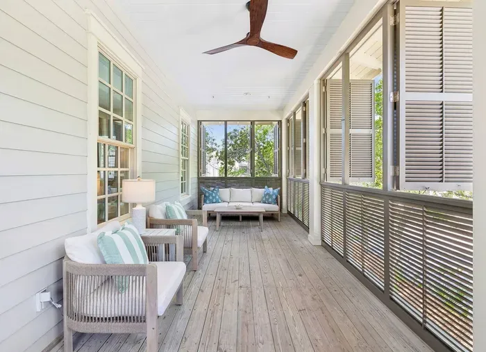 Tuck into a good book in the shade — this second-floor balcony is the home’s quiet corner, made for unwinding.