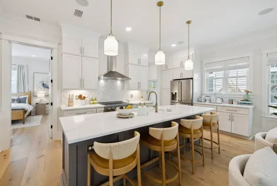 A true chef’s kitchen built for vacation feasts — an oversized quartz island, designer pendants and premium ZLINE appliances. Cooking for a crowd has never felt so easy.