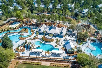 Float your cares away on the lazy river while the kids loop it again — Camp WaterColor is built for family fun.