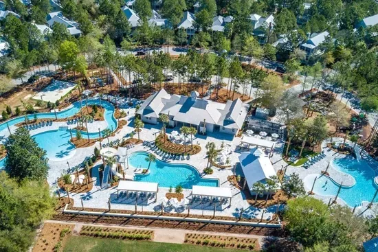 Float your cares away on the lazy river while the kids loop it again — Camp WaterColor is built for family fun.
