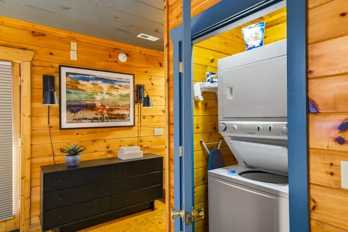 In-bedroom washer and dryer, with an iron provided for your convenience.