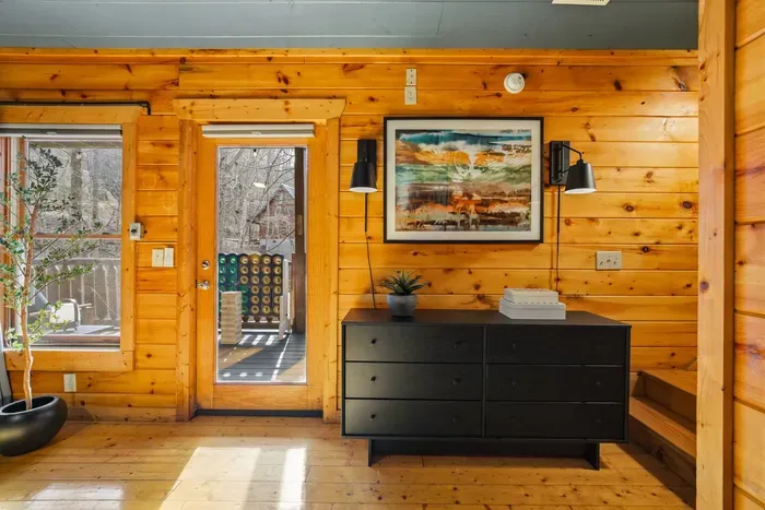 Dresser with artwork in the bedroom.