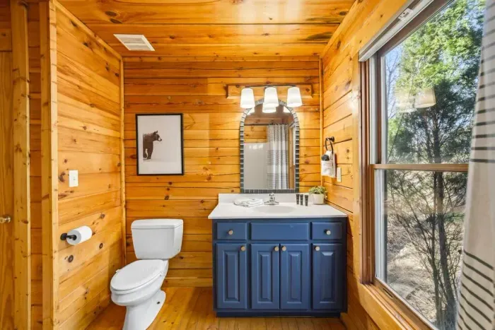 Charming mirror and vanity on the main level.