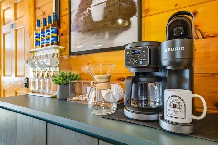 Enjoy your coffee using our logo coffee mugs—we’ve provided sugar and syrup for your convenience.