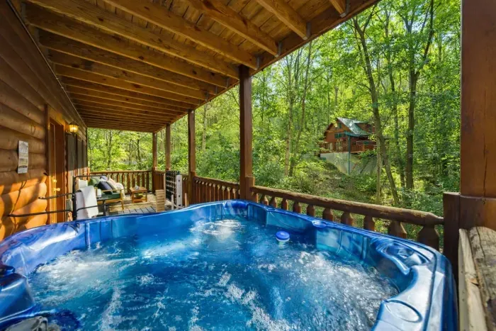 Relax in the hot tub while taking in beautiful tree views.