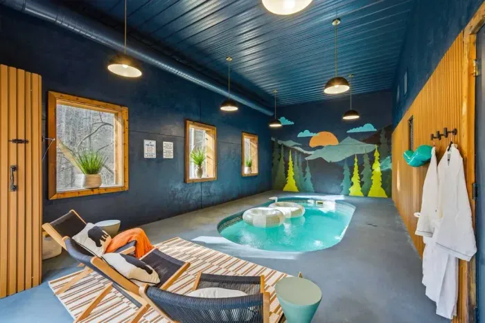 Private heated indoor pool on the lower level, designed for year-round relaxation. Please note that flotation devices in the pool for illustrative purposes only. They are not provided. Guests are welcome to bring their own if desired. 