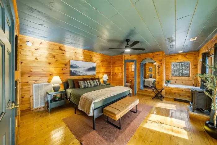 Spacious mid-level king bedroom featuring a private Jacuzzi tub.