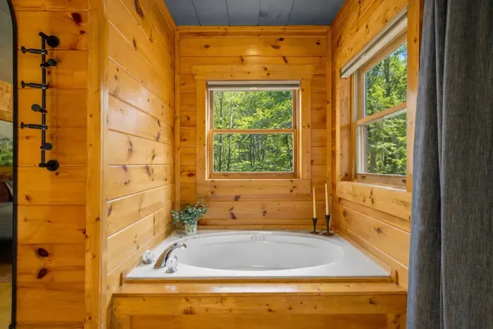 Spacious in-bedroom Jacuzzi tub for ultimate relaxation.