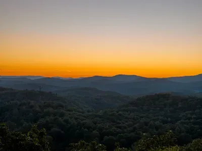 Breathtaking mountain sunset views over peaceful forested ridgelines