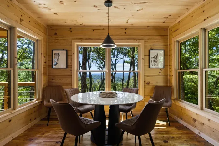 Sunny dining nook with panoramic forest and mountain views