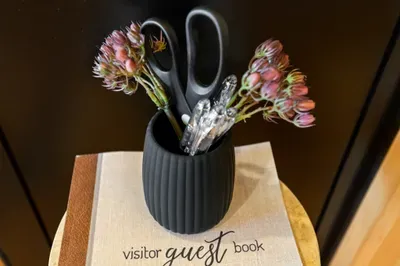Welcoming guest book vignette with charming floral accents