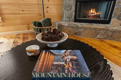 Cozy stone fireplace and warm wood interiors for the perfect cabin escape