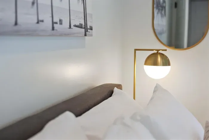 bedside lamp and comfy pillows
