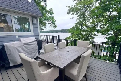Upper deck with dining table and grill