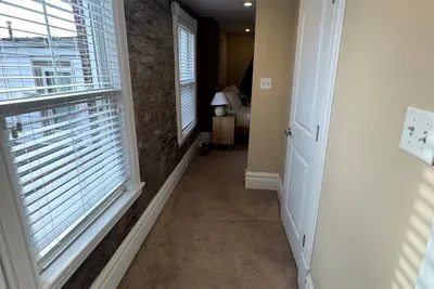Guest walk in closet walk way to bathroom