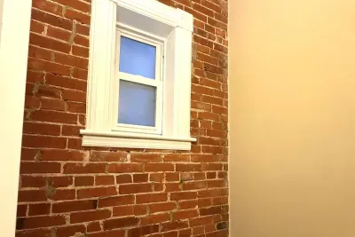 Exposed brick in bathroom #1 off living room