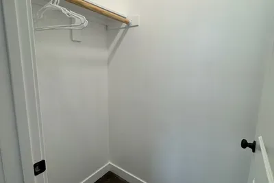 Closet in bedroom 2 with bunk beds