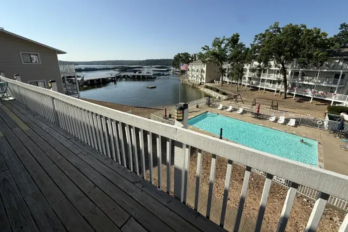 View from outside the front door overlooking the community pool and the lake