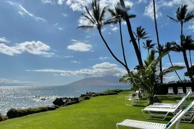 Shared community space with tables and lawn chairs with views of nearby islands