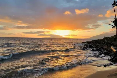 Sunset view from the beach right next to the property. Direct walking access from Kamaole Nalu complex