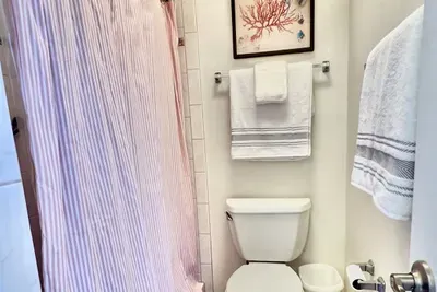 Standing shower in primary en-suite bathroom
